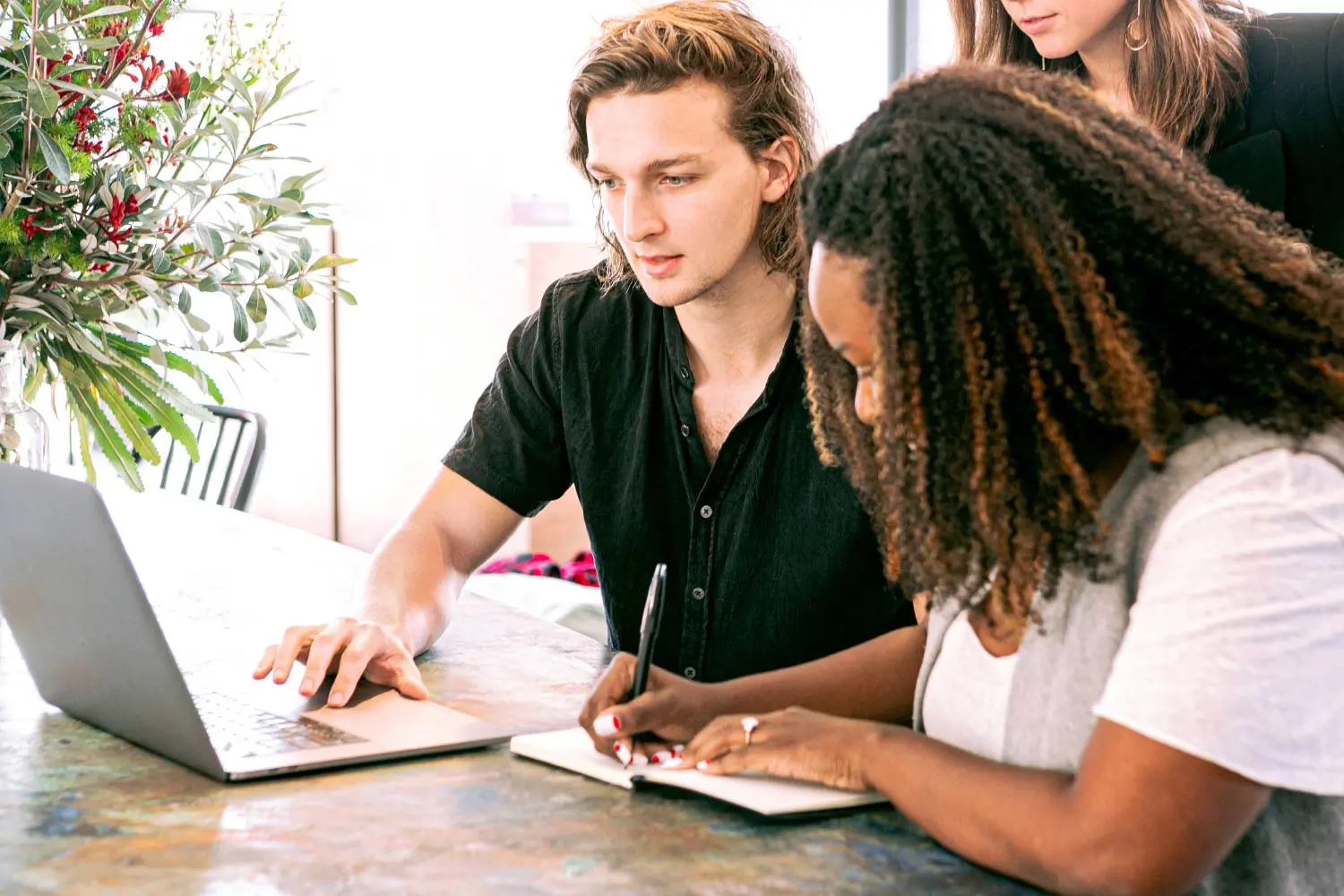 two people meeting about the company at the computer